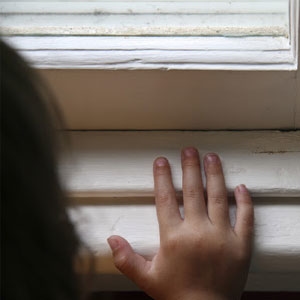 kids hand on a window